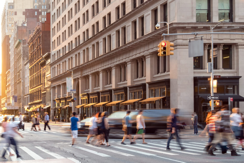New York City street scene with crowds of people walking in Midtown Manhattan